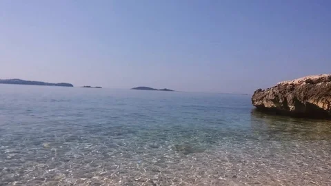 Coast at beautiful blue sea surface. Stock Footage 90235737