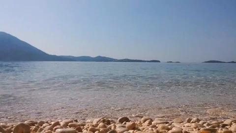 Coast at beautiful blue sea surface. Stock Footage 90235758