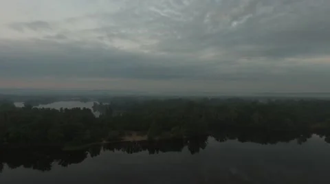 Coast of big river in the mist during dawn Video stock 63488441