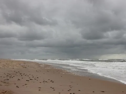 Coast with Empty Beach and Cloudy Weather Stock Photos