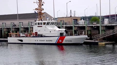 Coast guard boat at the ready in the harbor Stock Footage 336883167