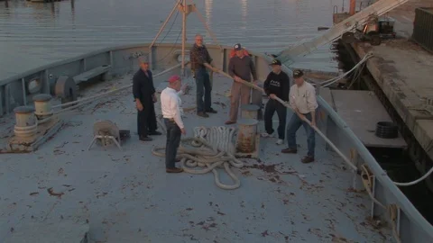 Coast Guard Cutter Deckhands handling the stern line in Baltimore, Maryland USA Stock Footage 105547334