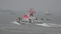 Coast guard lifeboat rescue demonstration at rainy cloudy day Bremerhaven harbor 4k or 4k+ Resolution
