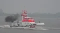 Coast guard lifeboat rescue demonstration at rainy cloudy day Bremerhaven harbor 4k or 4k+ Resolution