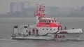 Coast guard lifeboat rescue demonstration at rainy cloudy day Bremerhaven harbor 4k or 4k+ Resolution