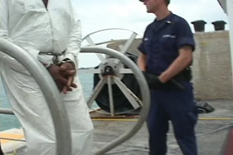 Coast Guard offloading drug smugglers from Cutter Stock Footage 12655529