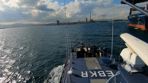 Coast guard sailing close to CMA CGM Lapis in Algeciras Bay. Stock Footage 106681665
