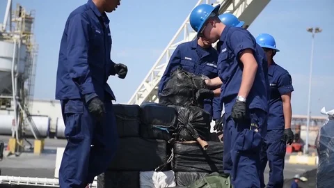 Coast Guard stacking sacks of cocaine seized in Eastern Pacific Stock Footage 92360334