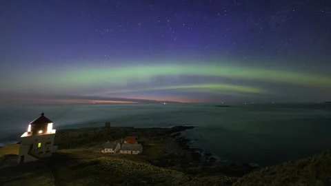 Coast with lighthouse in the night Stock Footage 250427781