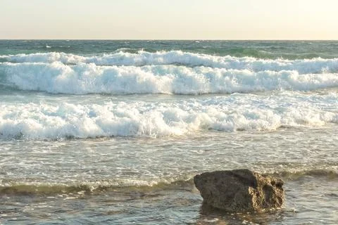 The coast of the Mediterranean Sea. The waves. The horizon. Sky and sea in su Stock Photos