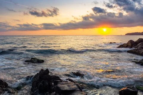 Coast of the ocean at sunset Stock Photos