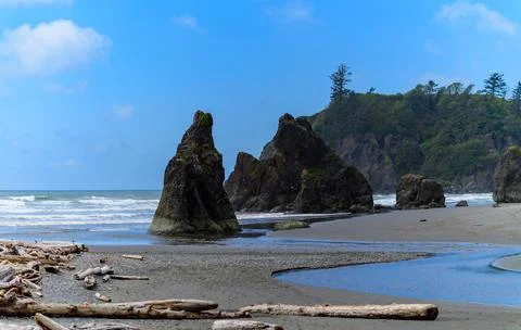 The coast of the Pacific Ocean, large cliffs and islands near the shore, Ol.. Stock Photos