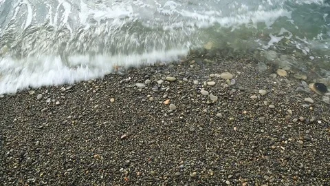 Coast of pebbles washed by the sea waves. Stock Footage 101318012