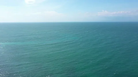 The coast of the sea with drone, rocks, sand and waves of the sea Stock Footage 230950620
