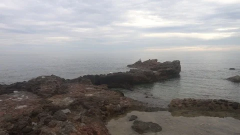 The coast in the sea of Santa Eulalia a cloudy day, Ibiza Stock Footage 102486784