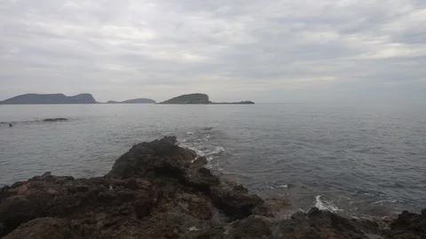 The coast in the sea of Santa Eulalia a cloudy day, Ibiza Stock Footage 102490576