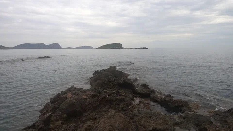 The coast in the sea of Santa Eulalia a cloudy day, Ibiza Stock Footage 102491393