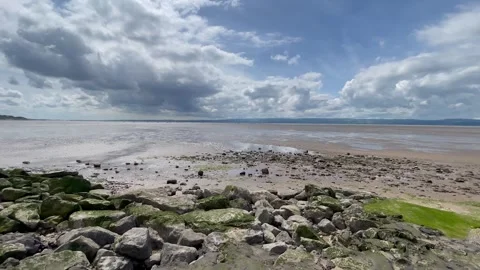 Coast Shore sand beach rocks tide moody atmospheric Stock Footage 276415795