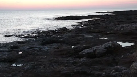 Coast shore at sunset sunrise with pan left to right Vídeo Stock 252153489
