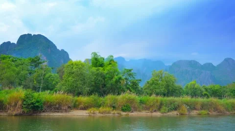 Coast of the small river and mountains in the background. laos, vang vieng Stock Footage 41847571