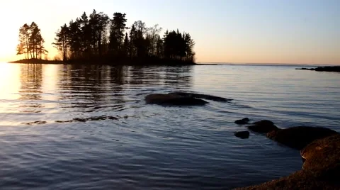The coast with stones on a sunset Stock Footage 59976814