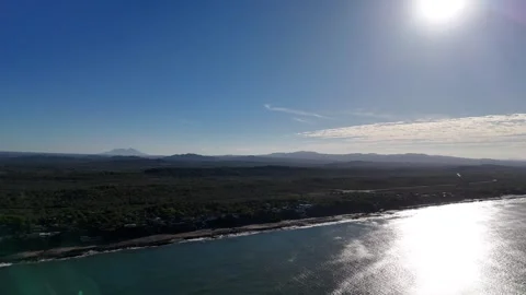 Coast view with mountains and clear sky in morning light Video stock 329187782