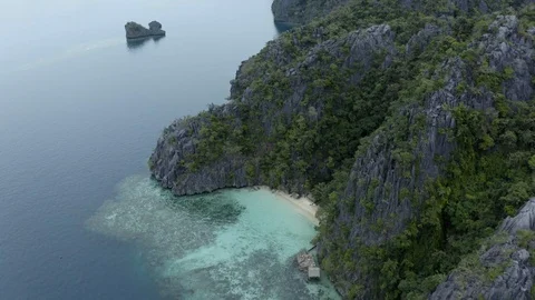 Coast view of rock formations and colored seabed Stock Footage 102838140