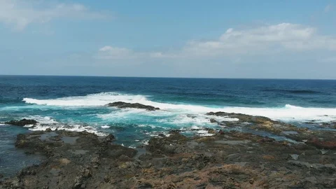 The coast of volcanic origin on a sunny day is an aerial photograph. North of Stock Footage 112096554