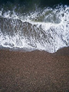 Coast with waves as a background from top view. Blue water background from dr Foto stock