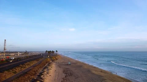 Coastal Beach vibes warm sunset glow. Huntington Beach, Orange County Stock Footage 332443041