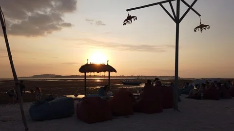 Coastal cafe at sunset, against the backdrop of a strong low tide. Stock Footage 111792015
