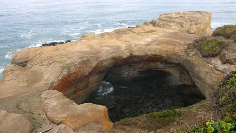 Coastal Cave on Beach at Devil's Punchbowl on the Oregon Coast Stock Footage 147693192