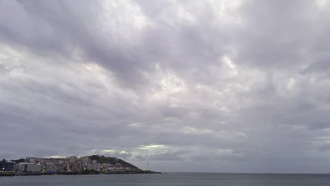 Coastal City Under Dramatic Cloudy Skies Video stock 275682063