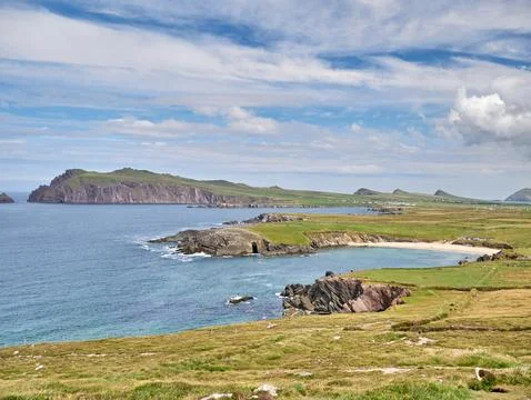 Coastal cliffs and bay under blue sky Stock-Fotos