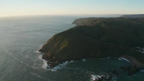 Coastal Cliffs and Ocean at Sunset Stock Footage 303082860