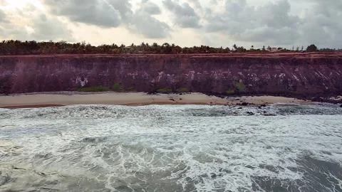 Coastal cliffs and rough sea at Praia de Pipa, Rio Grande do Norte. Stock Footage 314466632
