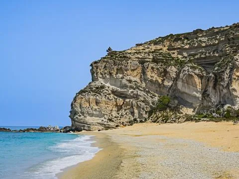 Coastal cliffs and sandy beach at Oasi Beach, Calabria Stock Photos