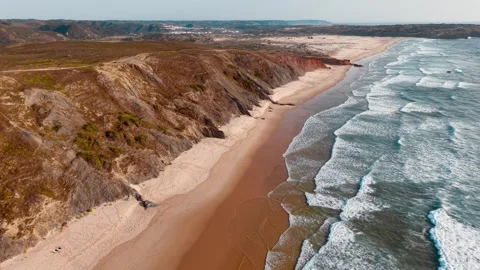 Coastal cliffs and sandy beaches of Portugal captured from above Stock Footage 312328727