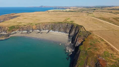 Coastal Cliffs and Traeth Llyfn Beach in Pembrokeshire Wales, Drone View 스톡 동영상 345504722