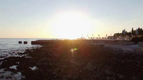 Coastal cliffs and waves in Poreč at sunset Stock Footage 321637126