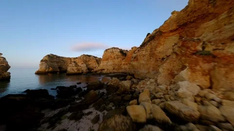 Coastal cliffs glow under warm sun Video stock 346091651