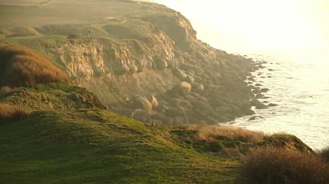 Coastal cliffs at sunset Stock Footage 10844032