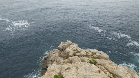 Coastal cliffs with waves in Punta Falconera Stock Footage 294204233
