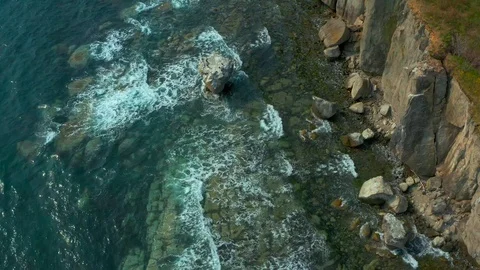 Coastal cliffs on which a sea  wave. Stock Footage 129701254