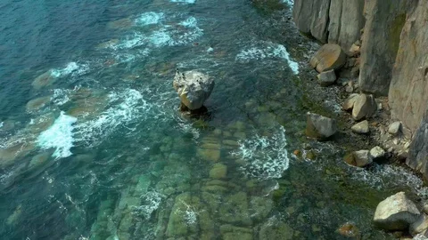 Coastal cliffs on which a sea  wave. Stock Footage 129701331