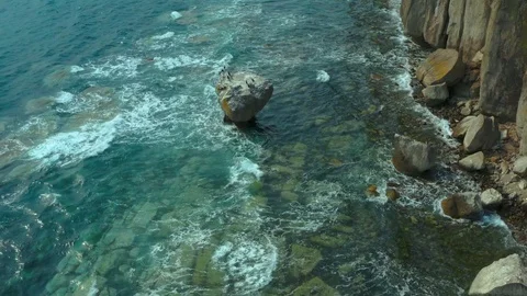 Coastal cliffs on which a sea  wave. Stock Footage 129701343