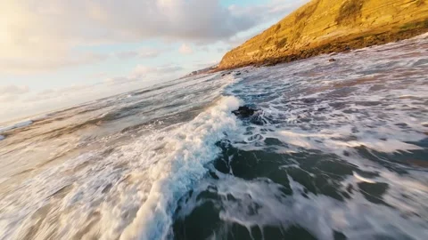 Coastal cliffside bathed in sunset glow Stock Footage 340914291
