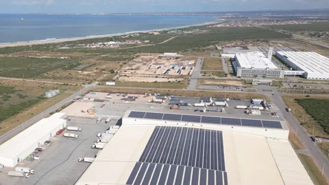 Coastal Cold Storage Port Warehouse with Solar Roof and Truck Activity Stock Footage 338027607