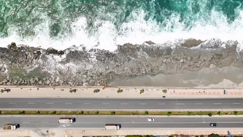 Coastal Commute: Aerial View of Beachside Traffic Flow Stock Footage 243185083