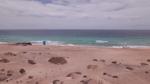 Coastal Drone Shot of a Parasail Setup at Piedra Playa, Fuerteventura Stock Footage 309021499